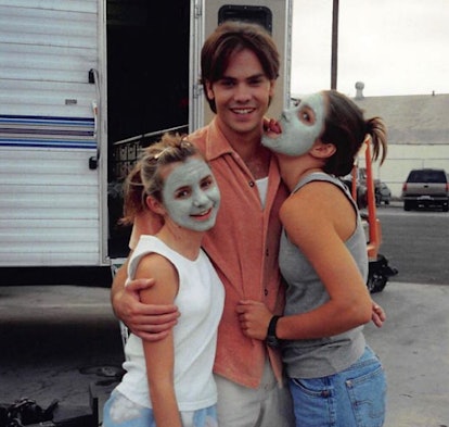 Beverley Mitchell posing for a photo with Barry Watson and Jessica Biel