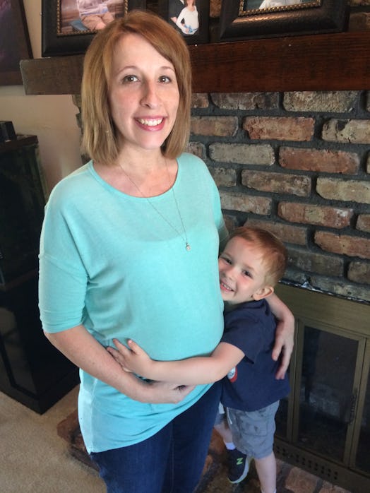 Pregnant Jessica Meyer posing with her son
