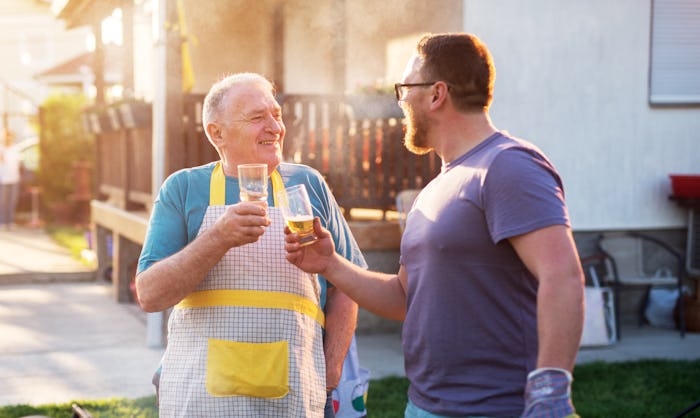 A father and a song giving a toast in their garden on Father's Day