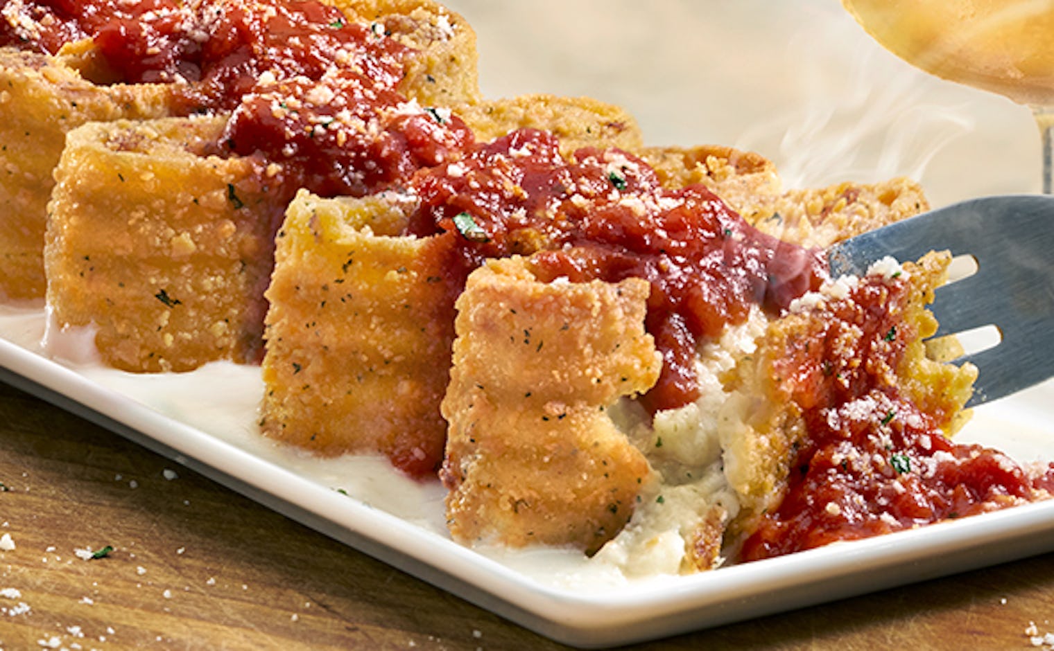 Olive Garden's CreateYourOwn Lasagna Offers 4 Different Sauces & 6