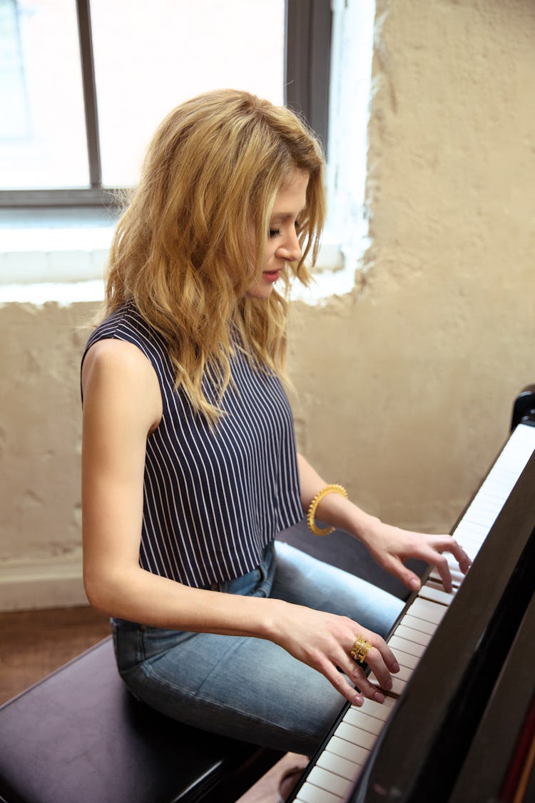Caissie Levy playing a piano