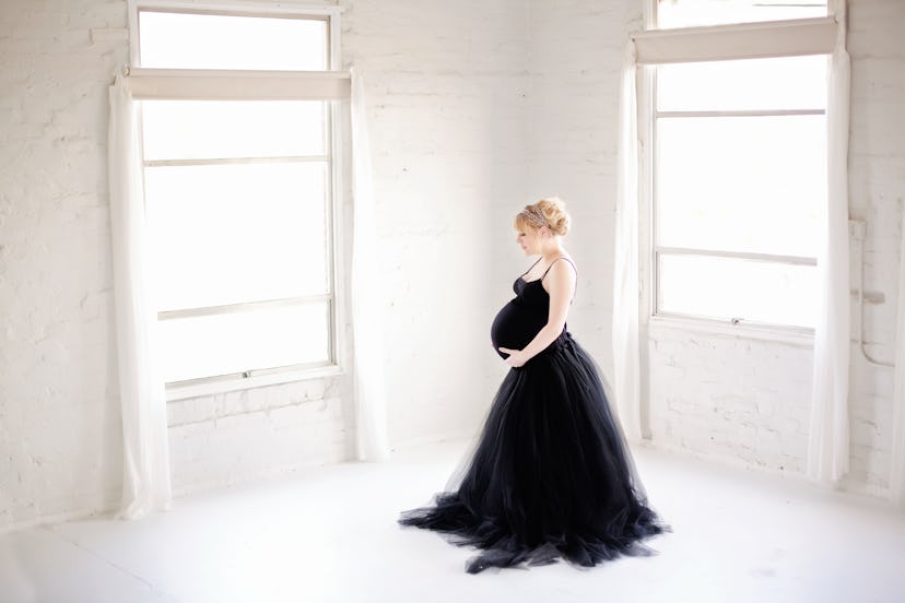 Burke 34 weeks pregnant with twins as a surrogate. Photo courtesy of Brea Bursch Photographer  