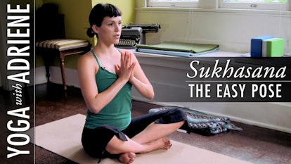 Girl doing yoga in a sukhasana pose and "Yoga with Adriene" text