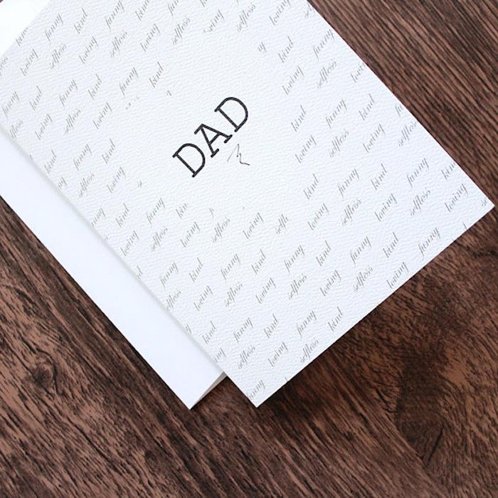 A sentimental Father's Day card with the word "DAD" on the front