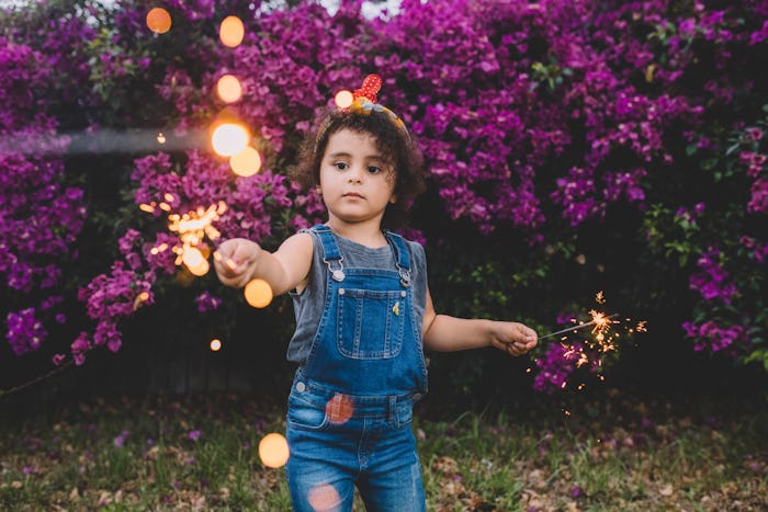 little girl with sparklers, can you light fireworks in a public park