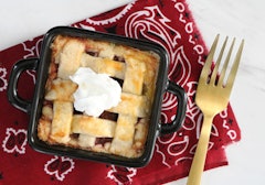 Cherry pie served in a cute mini casserole with whipped cream