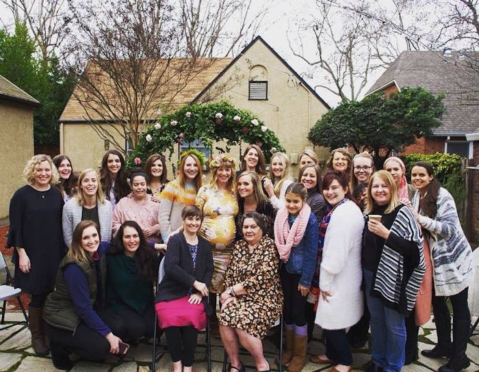 Big group of moms posing for a photo