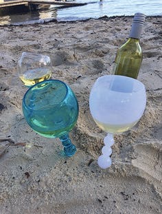 Aldi's Floating Wine Glasses Stay Up In The Sand & In The Water — And