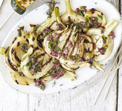 BBQ fennel served on a plate with black olive dressing