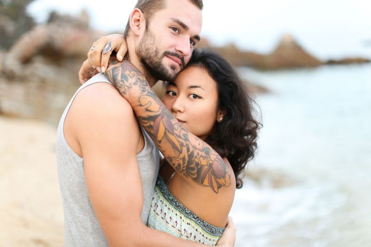 Woman on beach realizes partner doesn't love her as much as she loves him.