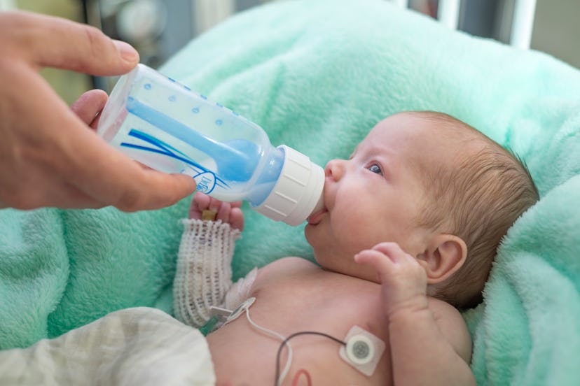 Baby at NICU drinking milk from the bottle