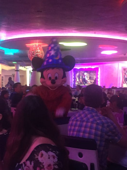 Disney night party where the main character is Mickey Mouse making people enjoy their time on the cr...