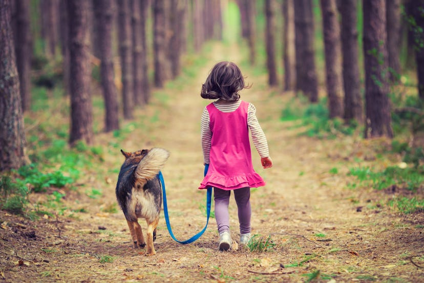 A girl walking her dog
