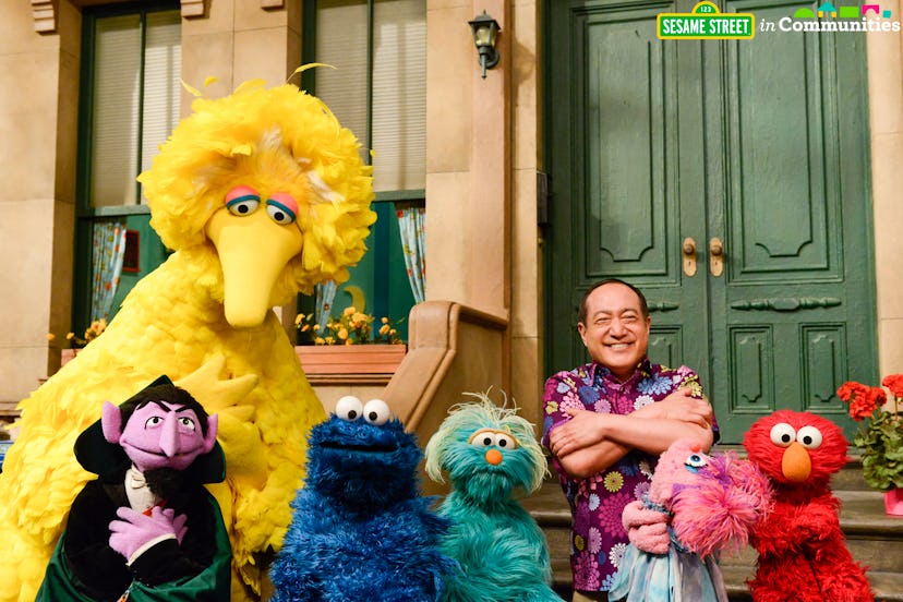 Image of a man with all the Sesame street birds