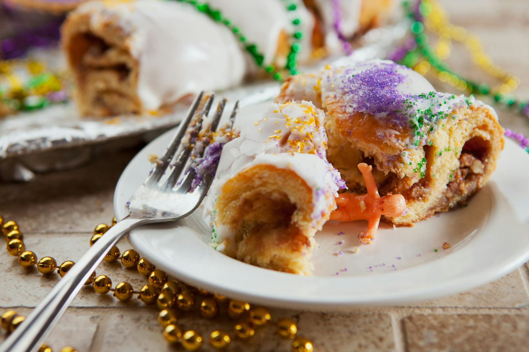 The History Of King Cake For Mardi Gras Is As Vibrant As The Tasty