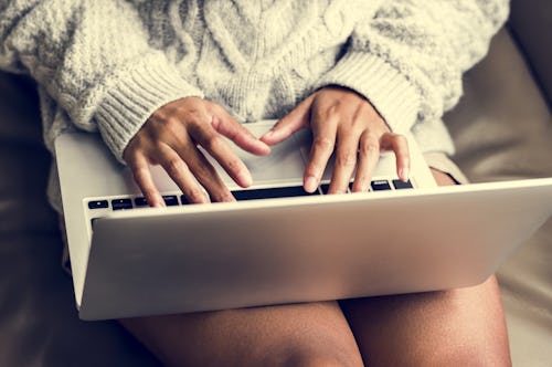 A woman searching the topic of telemedication abortion on her laptop