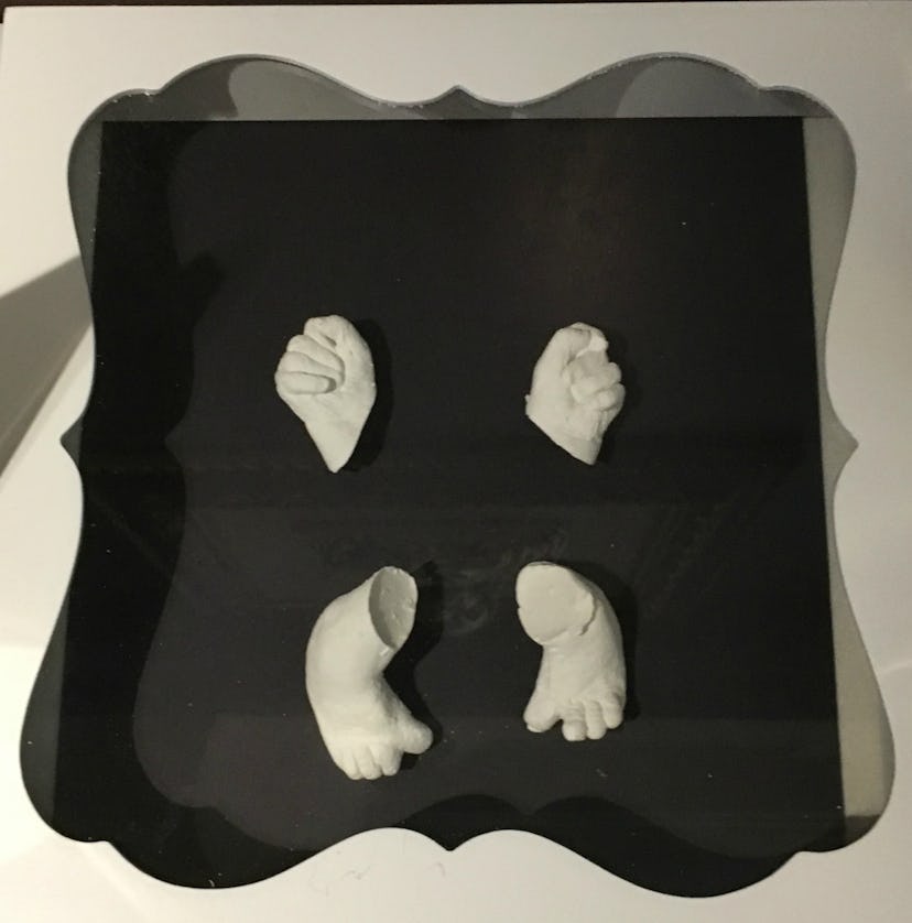 Plaster casts of a baby's hands and feet