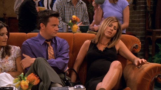 Jennifer Aniston as Rachel Green and Matthew Perry as Chandler Bing sitting on a couch in "Friends"