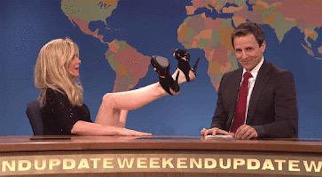 Kristen Wiig spreading her legs in a TV show