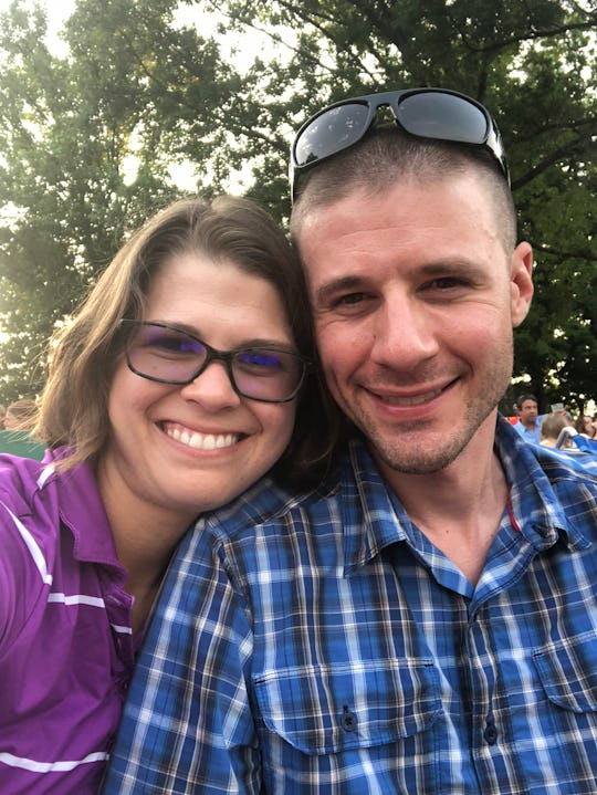 A man and woman taking a selfie, both smiling 