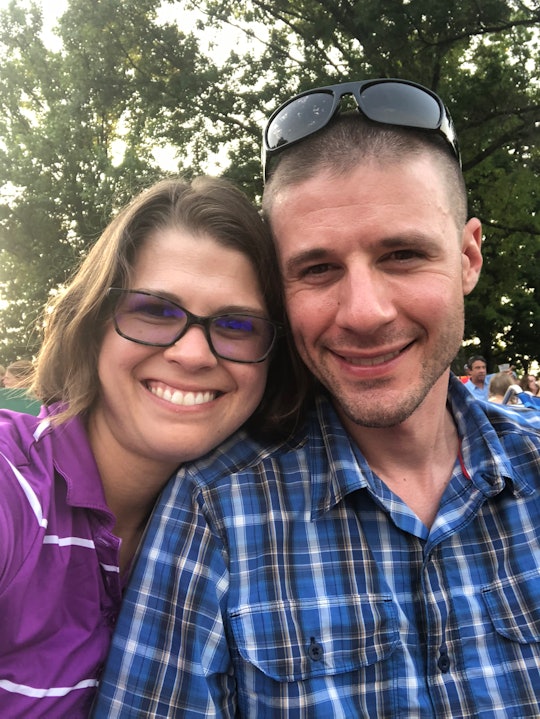 A man and woman taking a selfie, both smiling 