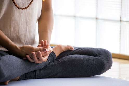 Woman meditating to boost her mood