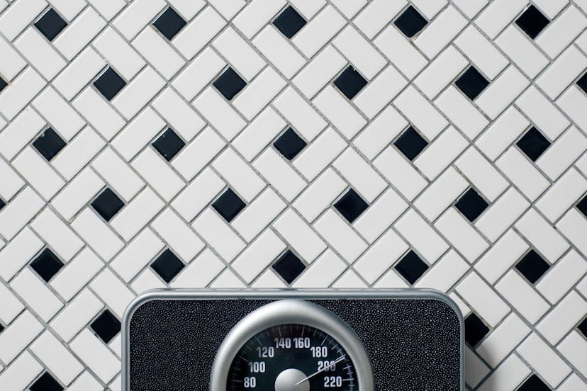 A scale on a ceramic floor