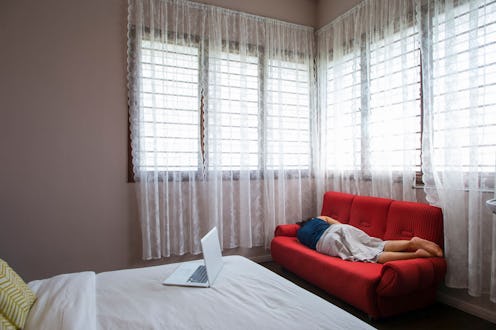 A person lying on the couch fighting depression