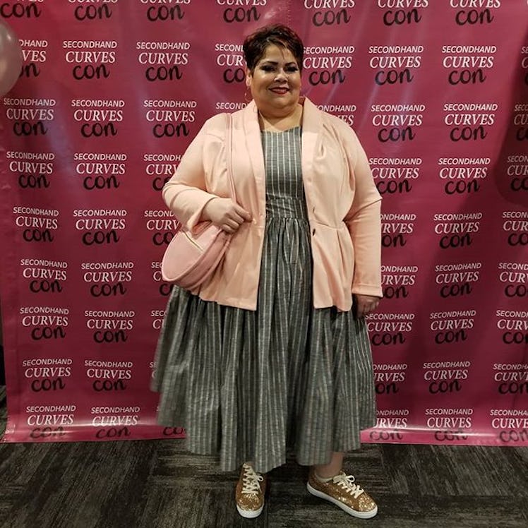 Plus-Size Influencer Marcy Cruz wearing striped dress with gold glitter sneakers.