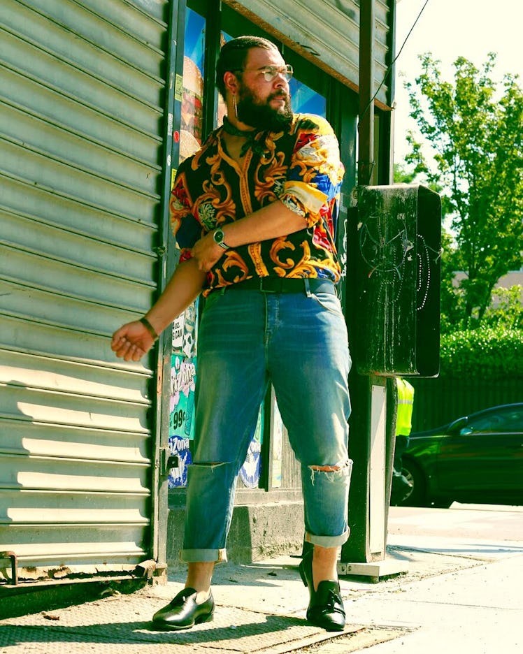 Plus-Size Influencer Marquis Neal in relaxed denim and shirt with chain details.
