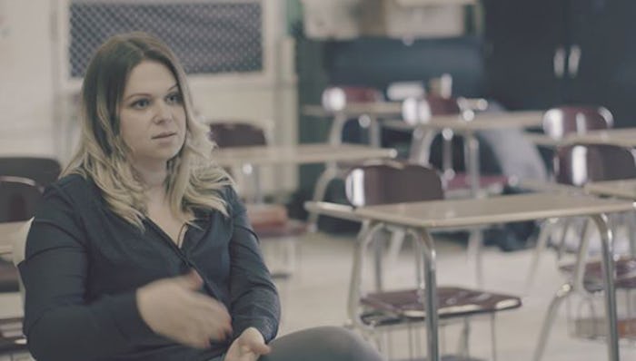 A teacher sitting at school