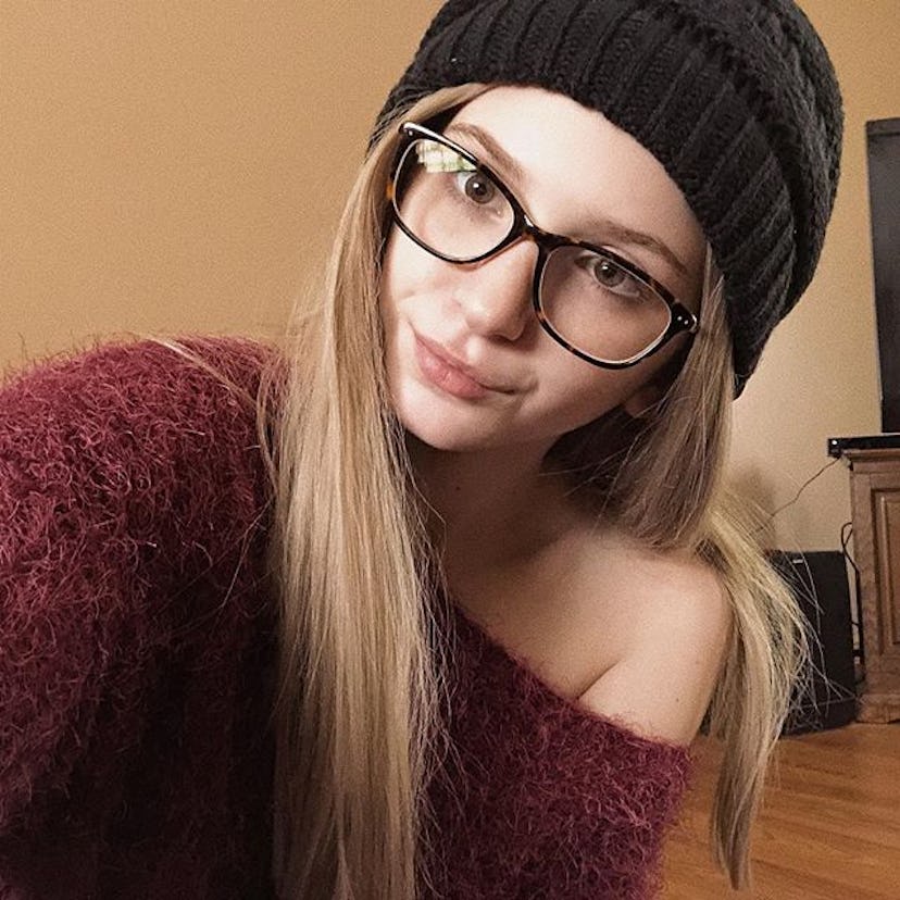 McKayla taking a selfie while wearing a black knit beanie and glasses