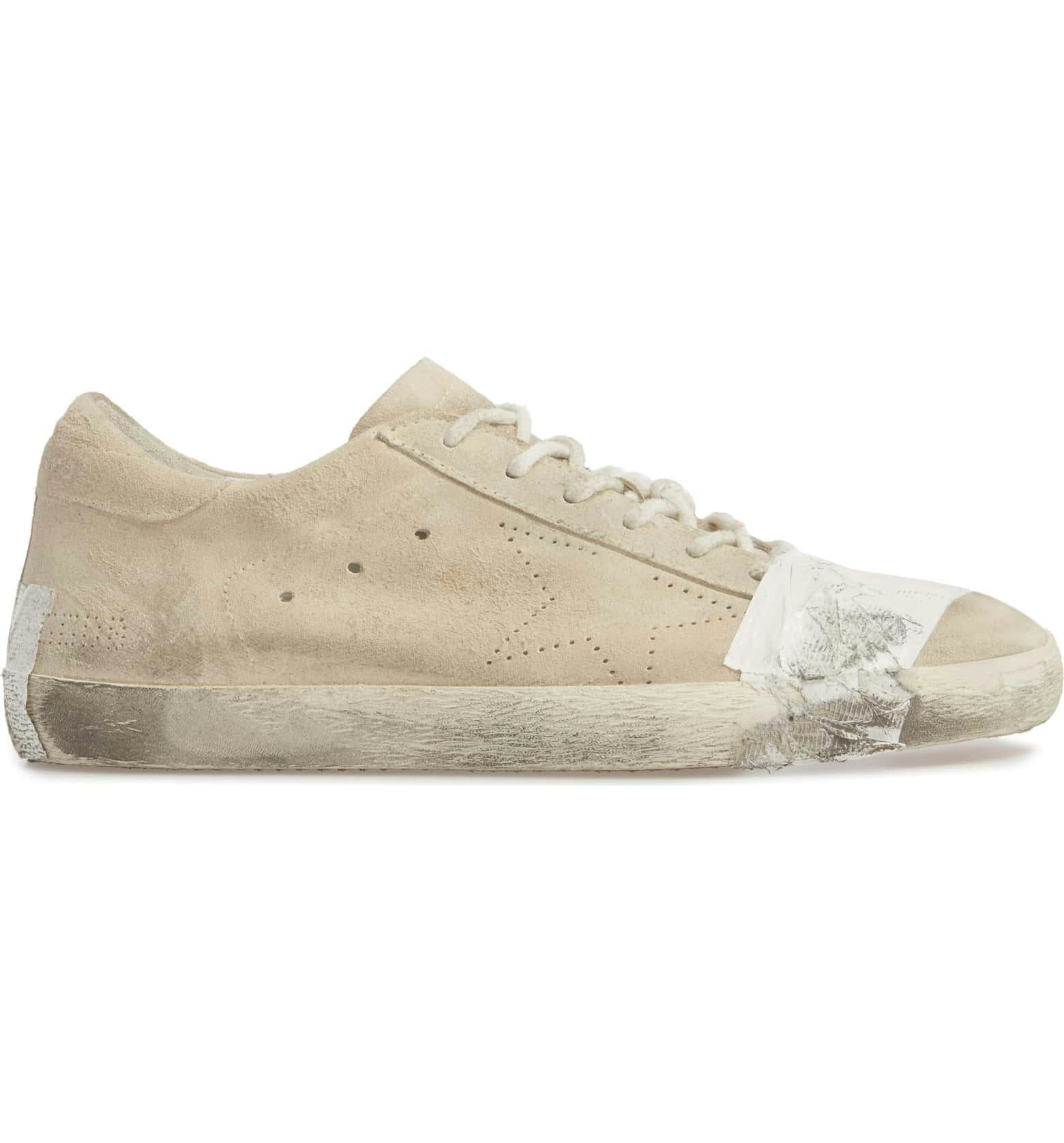 Golden Goose's Beat Up, Taped Sneakers Have The Freaking Out