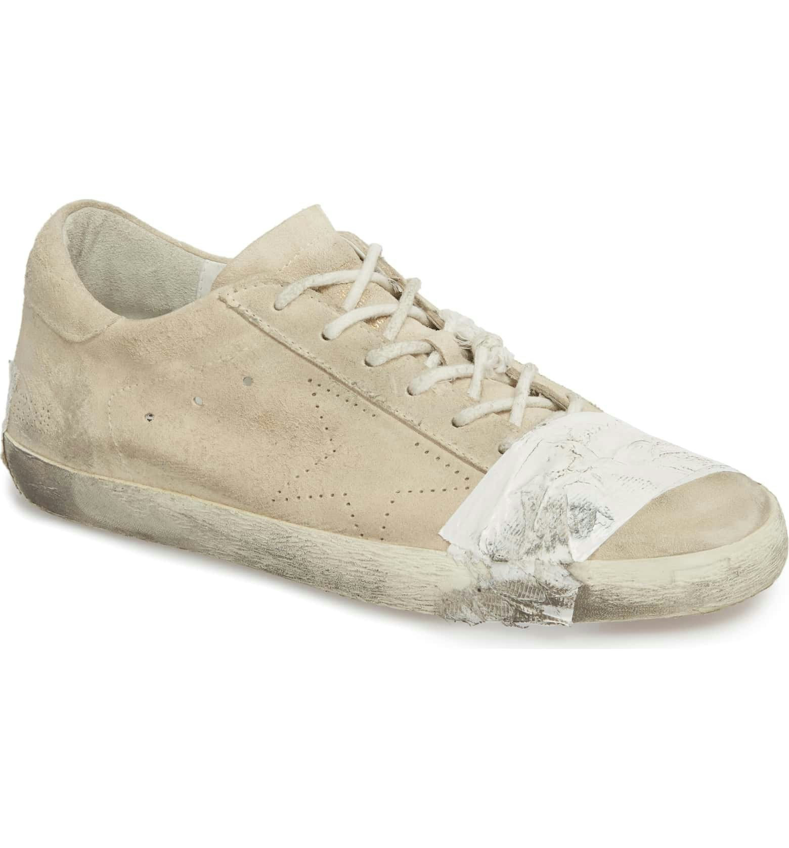 Golden Goose's Beat Up, Taped Sneakers 