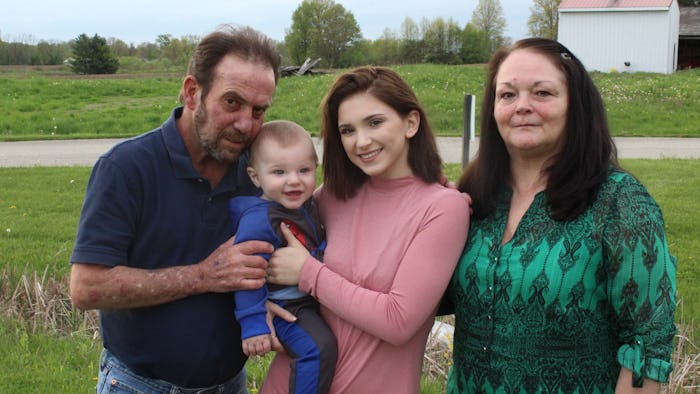 McKayla Adkins posing with two older people and a baby