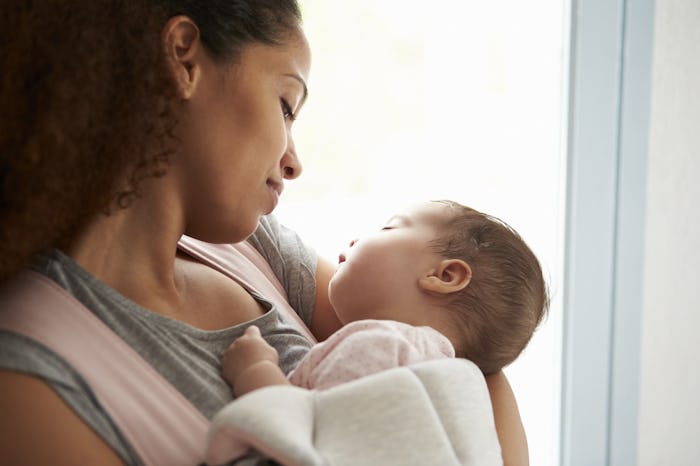 mother holding baby daughter