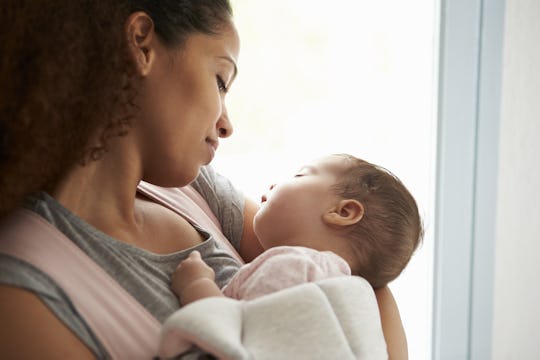 mother holding baby daughter