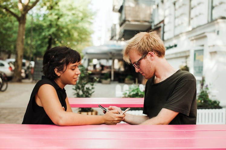 A couple who struggles to communicate texts during a date.