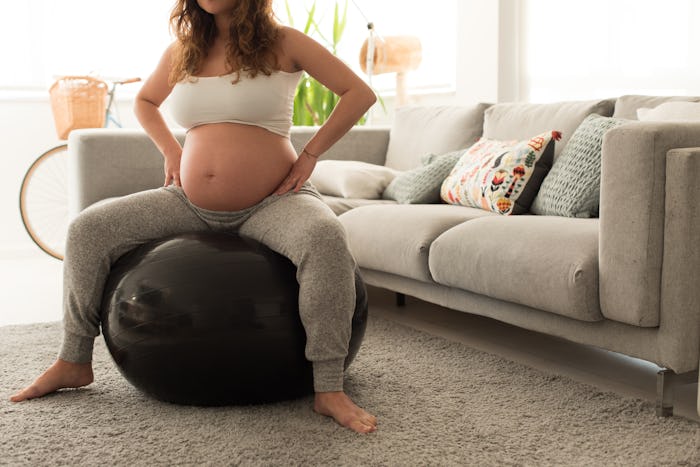 woman in labor on exercise ball