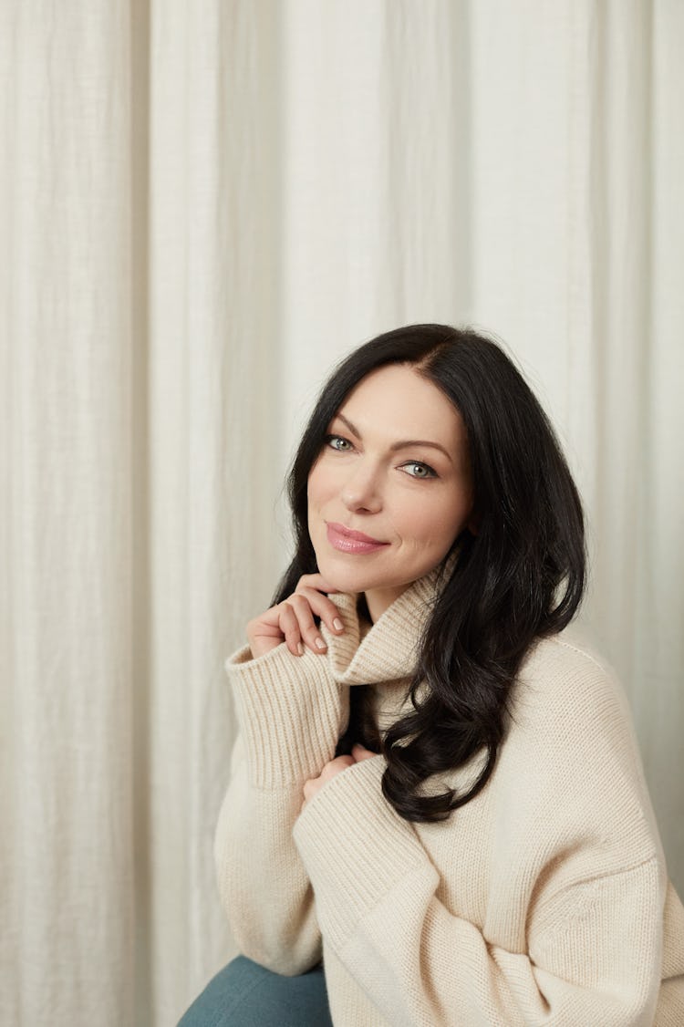 Portrait image of Laura Prepon wearing a white jumper