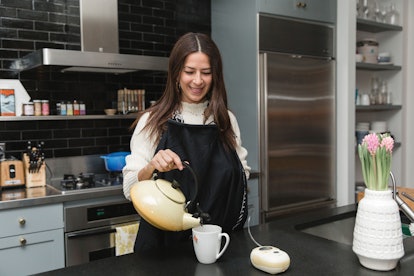 Rebecca Minkoff pouring tea in a cup