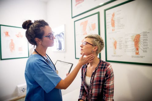A doctor doing a check-up of a woman with lyme disease