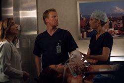 Owen, Amelia and Teddy stuck in an elevator with a patient in an episode of Grey's Anatomy