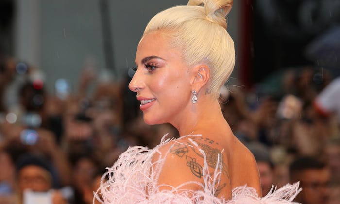 lady gaga displaying her back tattoos, meaningful memorial tattoo ideas