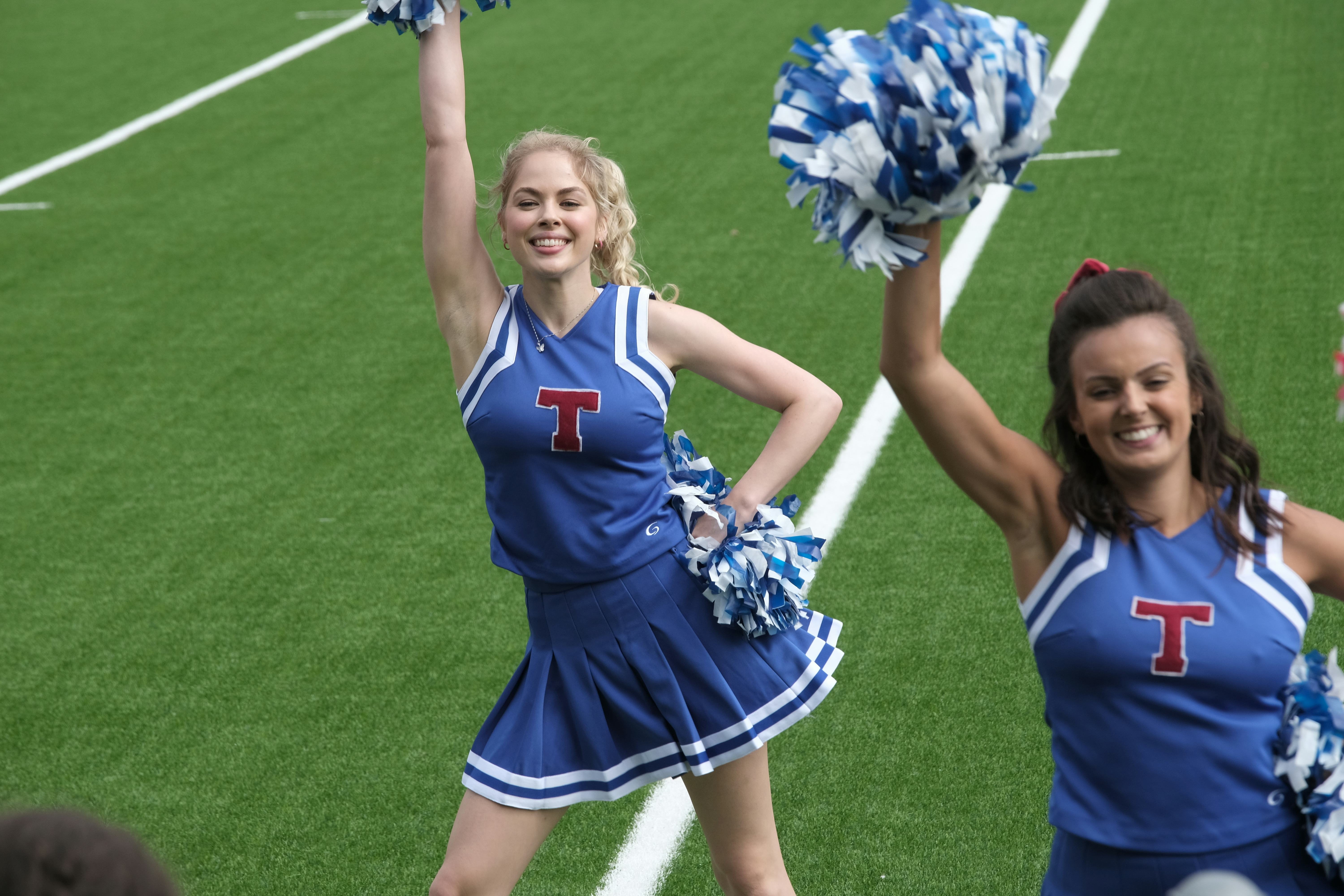 Goldie Cox and swarthy cheerleader