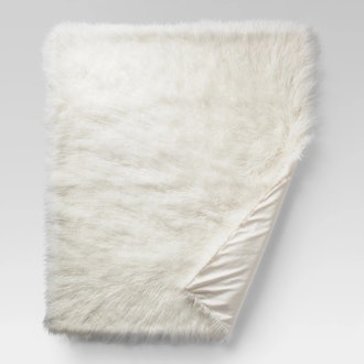 Mongolian Faux Fur Throw Blanket in Cream Project 62™