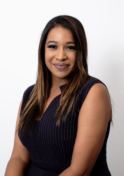 Jada Gomez posing in a black sleeveless shirt in front of the camera