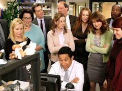 'The Office' cast looking at Oscar's computer, in need of Instagram captions.