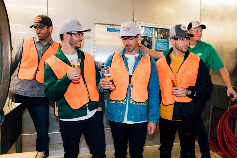 Kevin, Nick, and Joe Jonas visited the Coors brewery during their Happiness Begins tour.