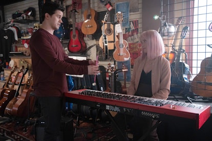 Jason Ritter as Eric and Allison Miller as Maggie on A Million Little Things sitting in a music shop...